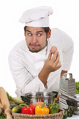 Image showing young funny chef and egg