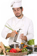 Image showing young chef preparing lunch 