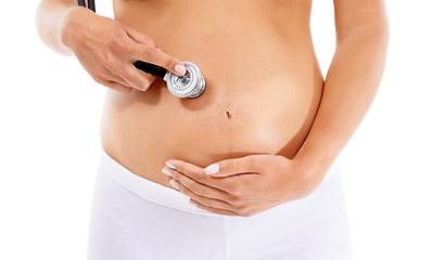 Image showing Healthcare, pregnancy and stomach of a woman with a stethoscope on a white background in studio. Baby, abdomen and pregnant woman listening for health of heartbeat of a child on a studio background