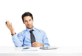 Image showing Portrait, documents and mockup with an annoyed businessman sitting in studio isolated on a white background. Review, gesture and a frustrated male employee working at his desk with blank space