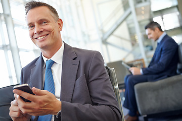 Image showing Smile, corporate or businessman with phone for invest strategy, finance growth or financial blog news. Travel, happy or CEO in airport lobby for social media, networking or internet website review