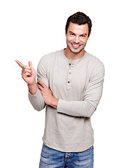 Image showing Man, happy and portrait while pointing finger at mockup space for advertising isolated on a white background. Smile of a male from France with hand sign for promotion, announcement and brand product