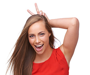 Image showing Comic, funny and bunny ears portrait of woman with happy, joyful and cheerful smile in studio. Happiness, crazy and funny face of isolated and goofy girl with rabbit ears at white background.