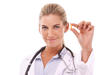 Image showing Portrait, pills and healthcare with a doctor woman in studio on a white background for health or insurance. Medical, tablet and pharmaceutical product with a female pharmacist holding medicine