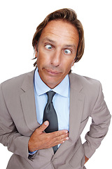 Image showing Comedy, crazy and man portrait of a business man with a silly face and suit with white background. Comic, joke and crossed eyes of a vertical executive isolated with funny face and humor being goofy