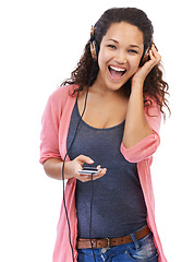 Image showing Portrait, music headphones and woman with phone in studio isolated on a white background. Cellphone, face and happy female with wooden headset streaming, listening or enjoying podcast, radio or audio
