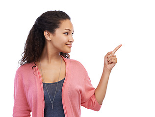 Image showing Mockup, pointing and advertising with a black woman in studio on a white background for marketing blank space. Idea, product and brand with an attractive young female showing copyspace with a point