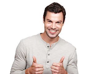 Image showing Portrait, hands and thumbs up with a man in studio isolated on a white background as a winner or for motivation. Thank you, goal and target with an excited man showing a positive hand sign or emoji