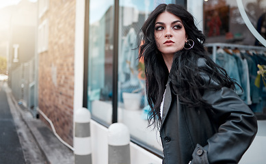 Image showing Urban fashion, style and a woman on the street at shop window, punk streetwear outside designer boutique. Beauty, make up and gen z fashion model or rock influencer in the city at store window.