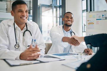 Image showing Doctor, handshake and meeting with patient, smile and greeting for vaccination education, talk or help. Black man, doctors and shaking hands with client for wellness, healthcare or medicine in clinic