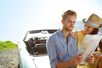 Image showing Road trip, adventure and couple with map by car on summer holiday, vacation and weekend getaway by ocean. Travelling, freedom and man and woman reading paper for directions, navigation and journey