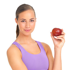 Image showing Healthy, fruit and portrait of a woman with an apple for health on a white background in a studio. Food, smile and fitness trainer with fruits for vegan diet and lifestyle on a studio background