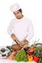 Image showing young chef preparing lunch 