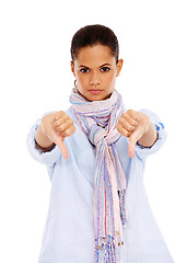 Image showing Portrait, thumbs down and emoji with a black woman in studio isolated on a white background to disagree. No, rejection and deny with a young female showing a negative hand sign on blank space