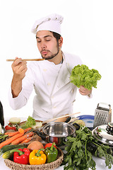 Image showing young chef preparing lunch 