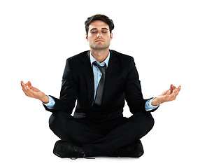 Image showing Yoga meditation, relax and business man meditate for work stress relief, spiritual mental health or chakra energy healing. Lotus, zen mindset peace and employee mindfulness on white background studio