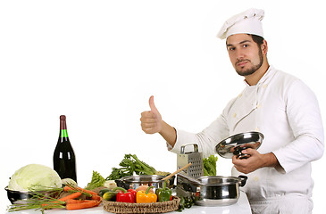 Image showing young chef preparing lunch 