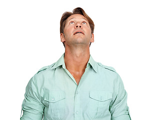 Image showing Idea, mature and man looking up in a studio with uncertainty, wonder and contemplation. Thinking, pensive and handsome male model daydreaming in a casual outfit while isolated by a white background.