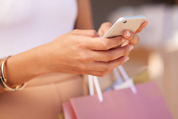 Image showing Hands with smartphone, woman and shopping bag at mall for retail therapy with technology and communication. Mobile app, phone zoom and shopping, fashion and designer clothes at outdoor shopping mall.