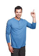Image showing Pointing up, man and model portrait with idea thinking with a smile in isolated white background. Happiness, ideas and planning of a person with casual clothes in a studio with mockup and a question