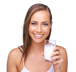 Image showing Portrait, calcium and a glass of a milk with a woman in studio isolated on a white background. Health, drink and diet with an attractive young female drinking a beverage for protein or vitamins