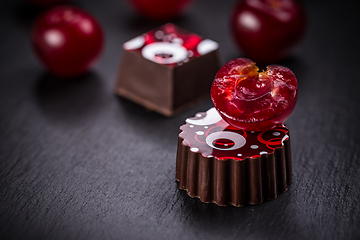 Image showing Chocolate pralines with cherry