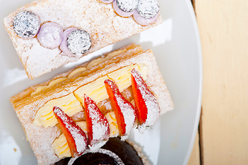 Image showing selection of fresh cream cake dessert plate