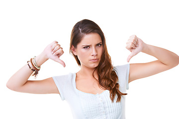 Image showing Woman, angry face and thumbs down portrait in studio for sad news, mental health depression and vote no. Model, upset or frustrated hands sign for anger, depressed headshot or negative body language