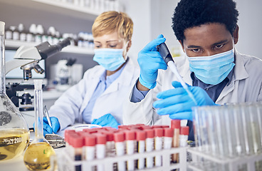 Image showing Science, innovation and covid, teamwork in laboratory with test tube and face mask, motivation in future vaccine or cure development. Healthcare, black man and scientist woman doing research in lab.