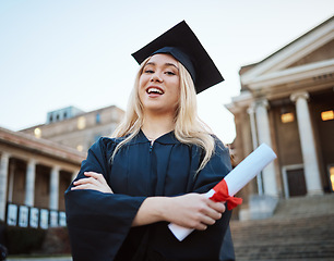 Image showing Portrait, graduation and success with a student woman holding a diploma or certificate outdoor as a graduate. Study, goal or unviersity with a female pupil standing outside after scholarship study