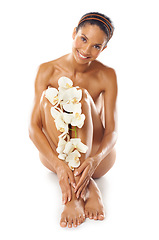 Image showing Portrait, beauty and skincare of woman with flowers in studio on a white background mock up. Floral cosmetics, organic makeup and female model with orchids on legs for skin treatment and body care.