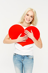 Image showing Heart, sign and portrait of woman in studio for love, paper and emoji against a white background. Face, shape and girl showing care, affection and self love, happy and content, young and beautiful