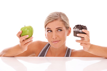 Image showing Woman, decision and choice for cupcake, apple and girl isolated on white studio background. Female lady and healthy lifestyle with dessert, fruit and snack for lunch, eating and thinking on backdrop