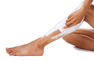 Image showing Skincare, razor and cream on legs of girl shaving for cosmetic beauty, hair removal and self care. Hygiene, grooming and aesthetic shave of wellness girl with white studio mockup for advertising