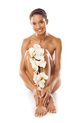 Image showing Skincare, portrait and beauty of woman with flowers in studio on a white background mock up. Floral cosmetics, organic makeup and female model with orchids on legs for skin treatment and body care.