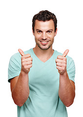 Image showing Thumbs up, happy and portrait of a man in a studio with success, good news and agreement. Happiness, smile and handsome male model with a yes, ok and approval gesture isolated by a white background.