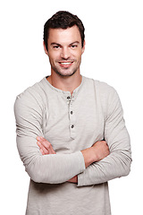 Image showing Handsome man, smile and arms crossed with vision for happy ambition, goals or profile against white studio background. Portrait of a isolated young male smiling with crossed arms on white background