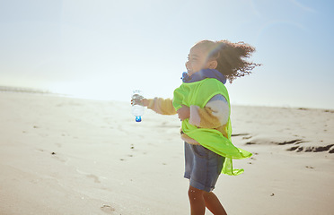 Image showing Plastic, beach and child recycling for earth day, planet or climate change education, learning and volunteering support for nonprofit. Recycle, environment and girl or kid with bottle for pollution