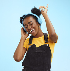 Image showing Music, dance and freedom with black woman and headphones, singing for relax, celebration and streaming. Audio, smile and technology with girl listening to online radio for playlist, energy and happy