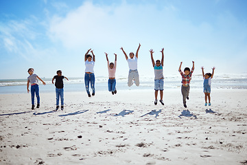 Image showing Big family, beach jump and adventure for holiday, sky and bonding for interracial diversity by waves. Happy family, mom and jumping with hands in air for solidarity, care or love on vacation by sea