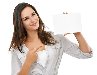 Image showing Woman pointing to mockup poster for advertising, marketing or branding sign on isolated white background. Studio portrait of a model hand holding paper or card with empty space for design mock up