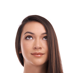 Image showing Face, mockup and idea with a woman in studio isolated on a white background to promote product placement. Marketing, mock up and space with an attractive young female on blank space for advertising