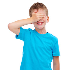 Image showing Children, hide and seek and surprise with a boy in studio isolated on a white background covering his face with his hand. Kids, blind and game with a male child playing on blank advertising space