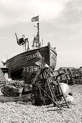 Image showing traditional wood fishing boat with pirate flag