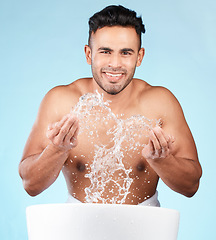 Image showing Cleaning, water splash and portrait of man happy with self care routine, facial hygiene and body hygiene wash. Water drop, bathroom skincare hydration and beauty model with health wellness treatment