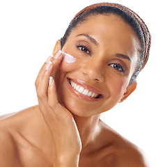 Image showing Beauty cream, skincare and face of woman in studio on a white background. Portrait, makeup cosmetics and young female model apply facial lotion, creme or moisturizer for healthy skin and wellness.