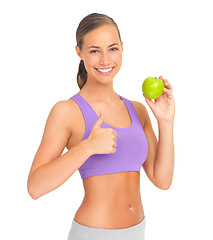 Image showing Thumbs up, apple and fitness of woman in studio isolated on white background. Face, portrait and female model with hand gesture and fruit for healthy diet, wellness or nutrition, vitamins or minerals