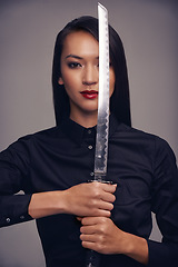 Image showing Portrait, ninja and sword with warrior woman in studio on a gray background for martial arts or combat. Training, fantasy and weapon with an asian samurai ready to defend using self discipline