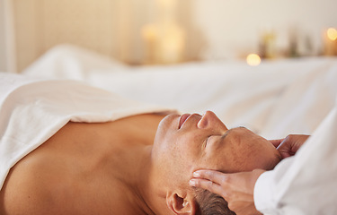 Image showing Spa, man and massage for wellness, luxury and relax for health, peace or lying on table. Male person, self care and zen for healthy lifestyle, treatment or grooming for stress relief and head massage