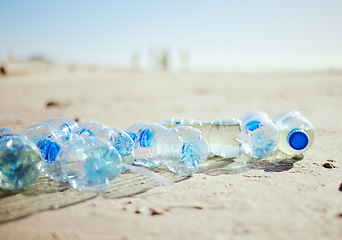 Image showing Plastic bottles, beach sand or litter in recycling volunteering, global warming sustainability or earth community service. Zoom, trash texture or ocean waste management in environment nature cleaning